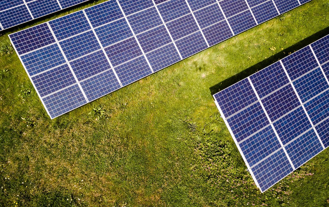 Solar panels located in a field of grass